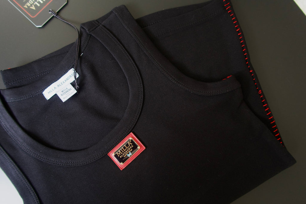 Fitted tank top with red contrast stitching and a red-bordered brand patch